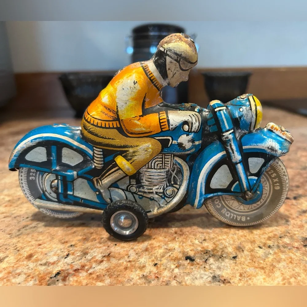 Tin Lithograph Friction Drive Ballon Cordatic toy cycle EN-12-63 Vtg 1950 Era.